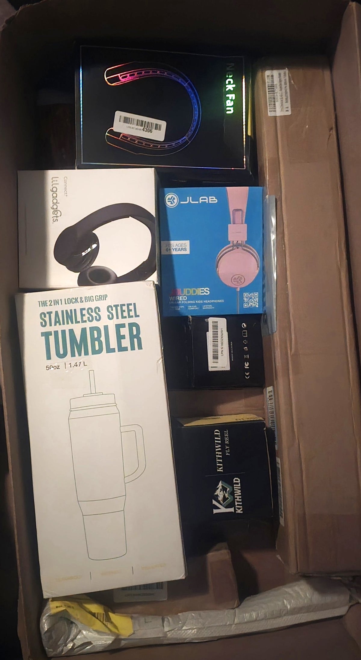 The actual box, opened, showing the packed items
